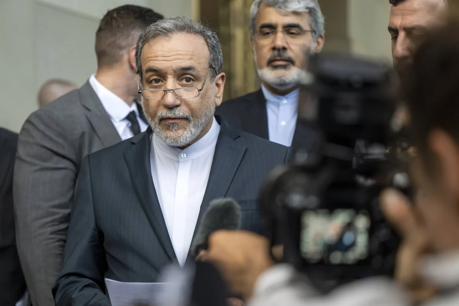 Iranian Foreign Minister Abbas Araghchi talks to the media in front of the Intercontinental Hotel, after a meeting of foreign ministers of Germany, France, Britain and the EU with Iranian officials for the Iran-EU nuclear talks, in Geneva, Switzerland, 20 June 2025, amid the recent military escalations between Israel and Iran.  EPA/MARTIAL TREZZINI