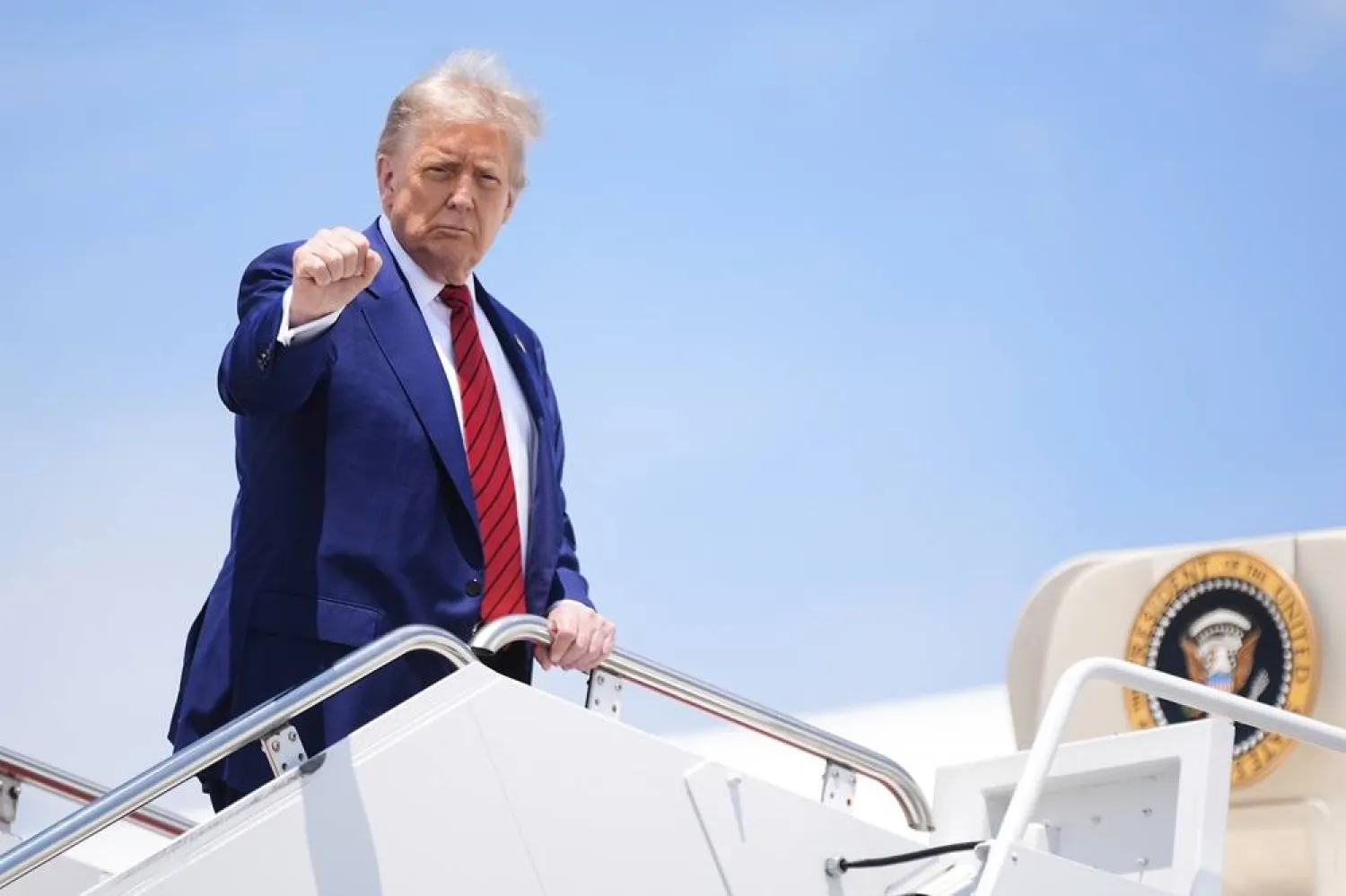 President Donald Trump gestures as he boards Air Force One at Joint Base Andrews, Md., Friday, June 20, 2025. (AP) 