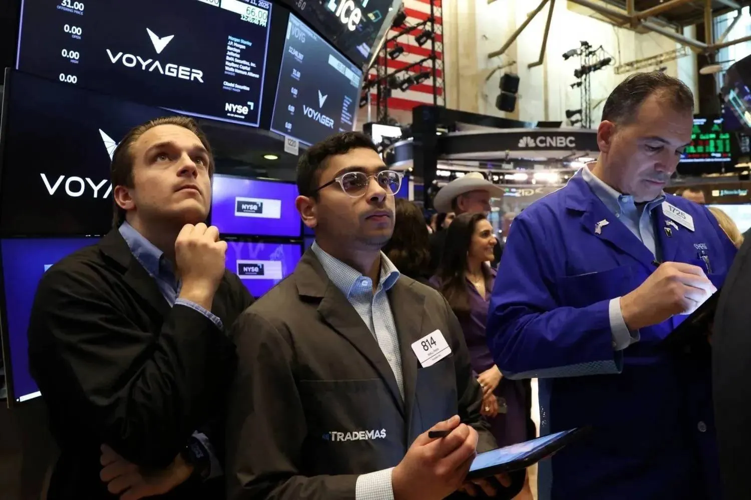 Traders monitoring the movement of stocks on Wall Street (Reuters)