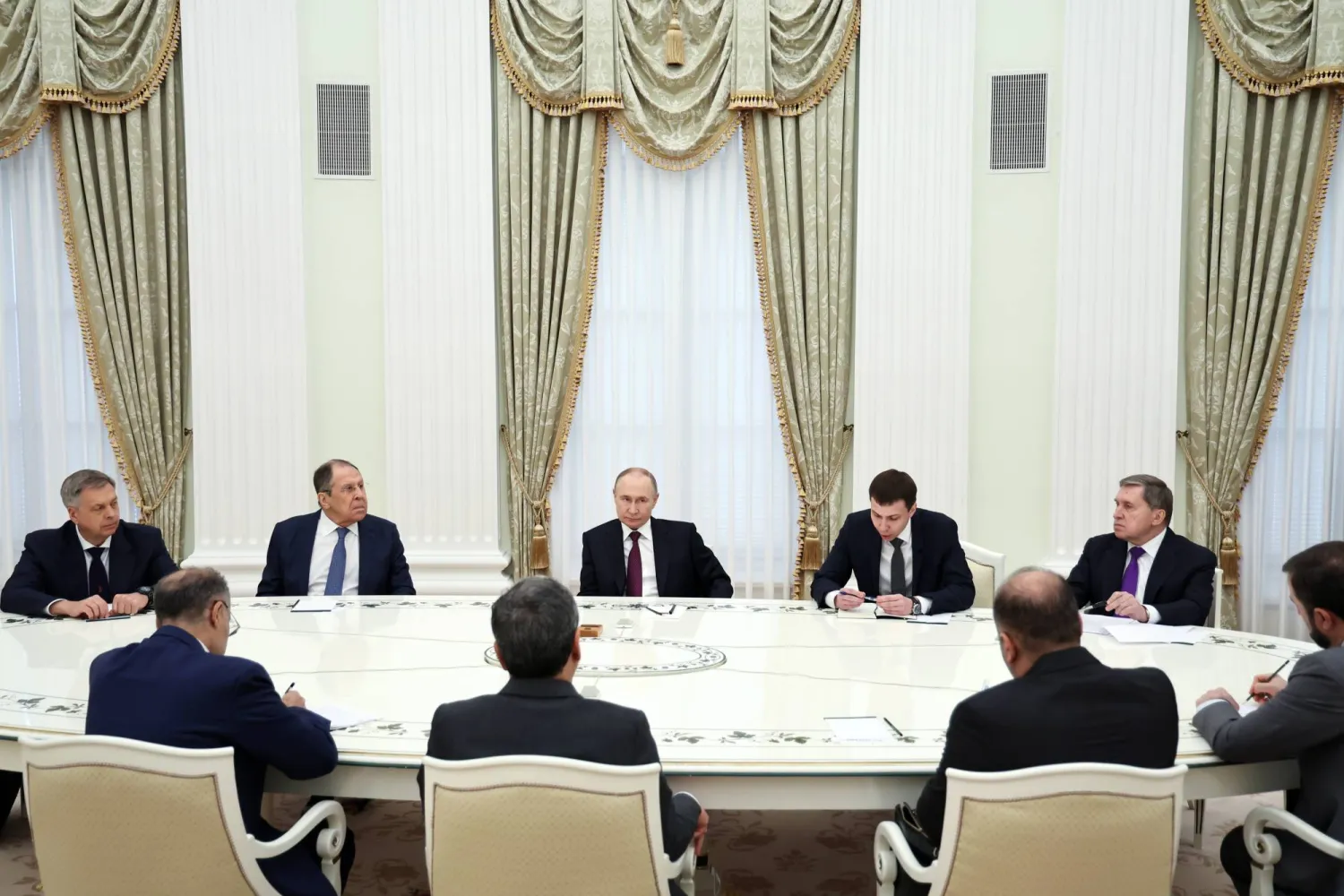 Russian President Vladimir Putin (C, back) attends a meeting with Iranian Foreign Minister Abbas Araghchi (C, front) at the Kremlin in Moscow, Russia, 23 June 2025.  EPA/ALEXANDER KAZAKOV / SPUTNIK / KREMLIN POOL