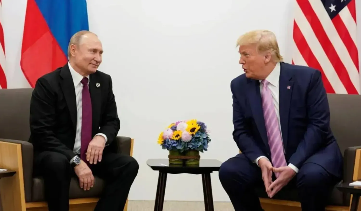 US President Donald Trump and Russian President Vladimir Putin meet in 2019. (Reuters)
