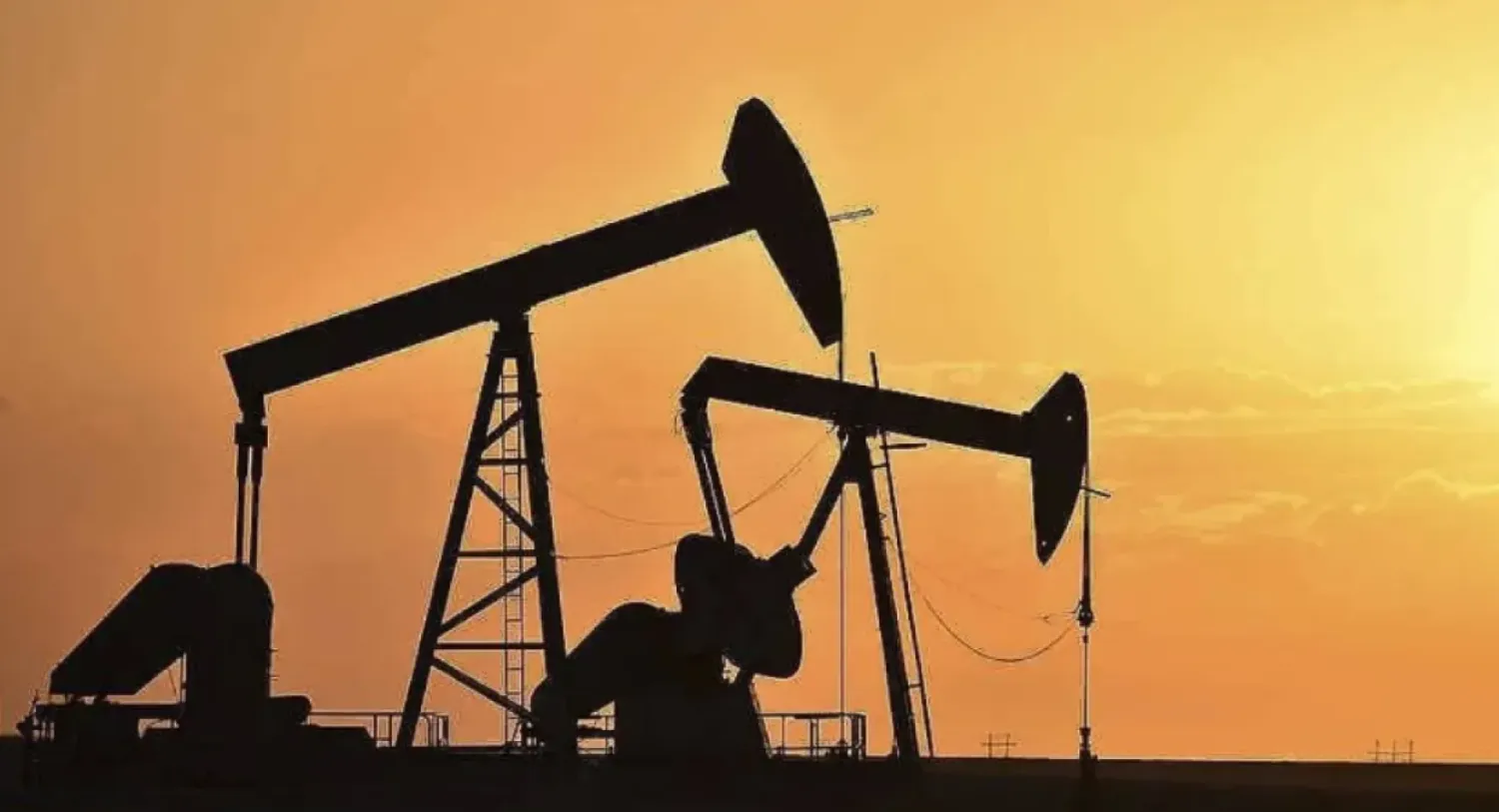FILE - Pump jacks extract oil from beneath the ground in North Dakota, May 19, 2021. (AP Photo/Matthew Brown, File)