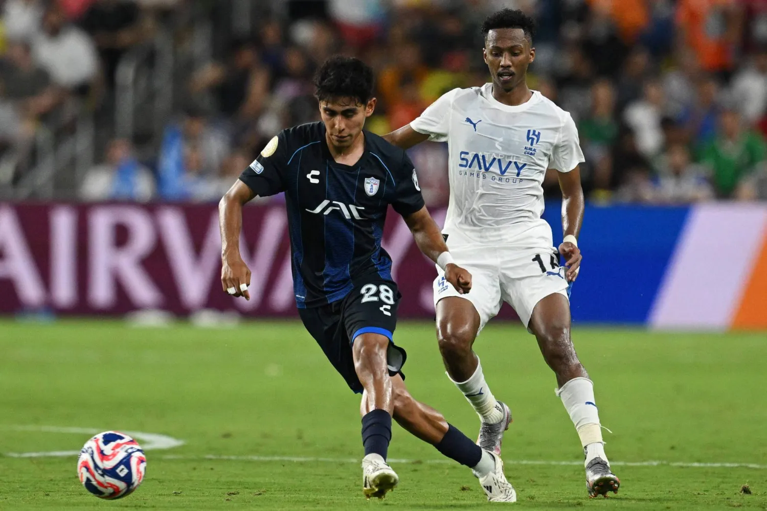 Pachuca's Mexican midfielder #28 Elias Montiel and Al Hilal's Saudi midfielder #16 Nasser Al-Dawsari fight for the ball during the FIFA Club World Cup 2025 Group H football match between Saudi's Al-Hilal and Mexico's Pachuca at the Geodis Park stadium in Nashville on June 26, 2025. (Photo by Federico PARRA / AFP)