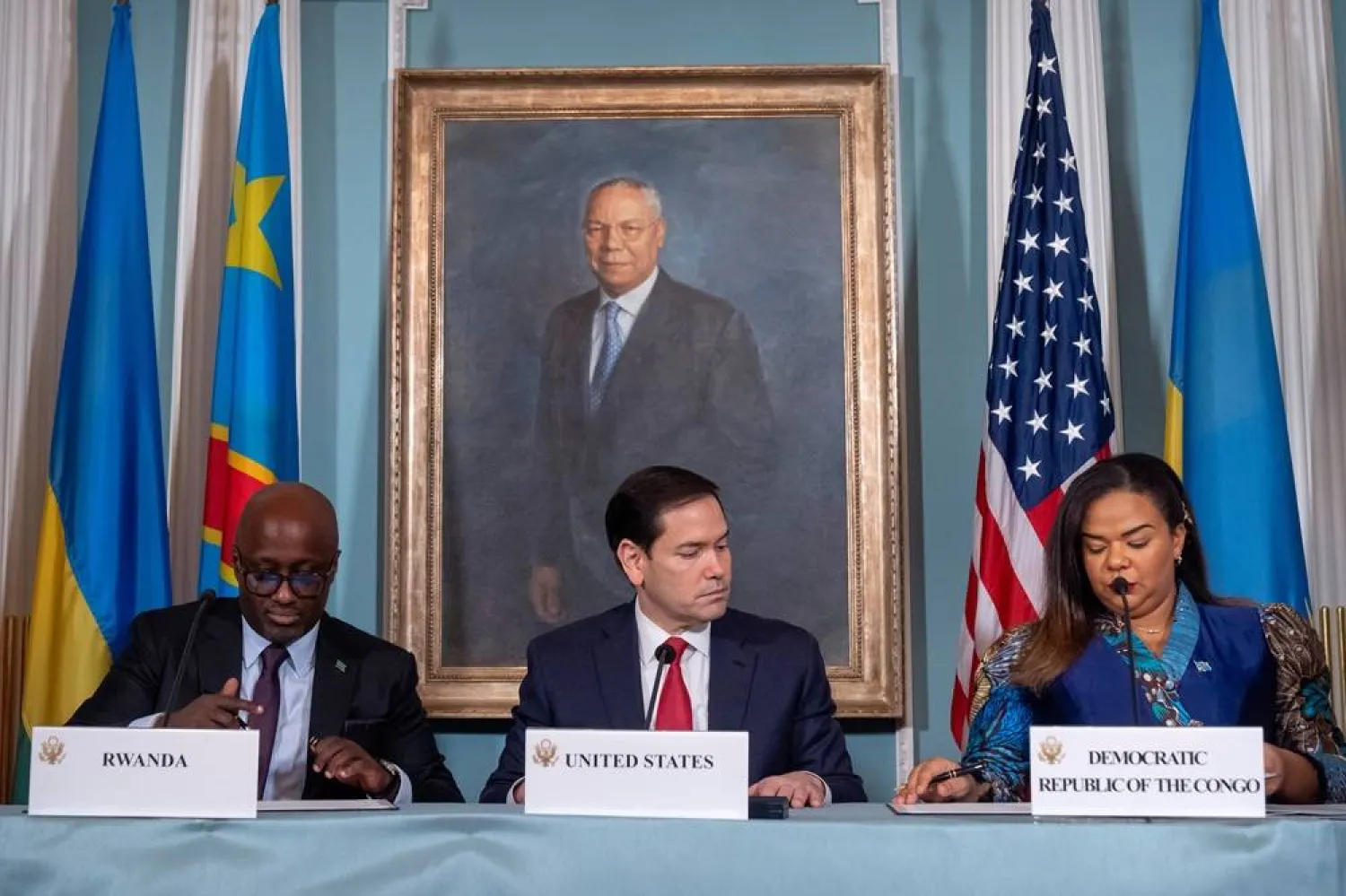 Secretary of State Marco Rubio, center, watches as Rwanda's Foreign Minister Olivier Nduhungirehe, left, and Democratic Republic of the Congo's Foreign Minister Therese Kayikwamba Wagner, right, sign a peace agreement at the State Department, Friday, June 27, 2025, in Washington. (AP) 