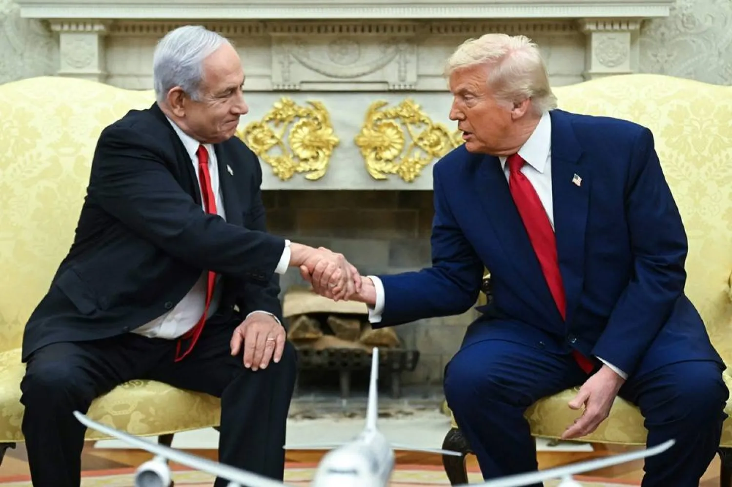 US President Donald Trump shakes hands with Israeli Prime Minister Benjamin Netanyahu during a meeting in the Oval Office of the White House in Washington, DC, on April 7, 2025.  (AFP)