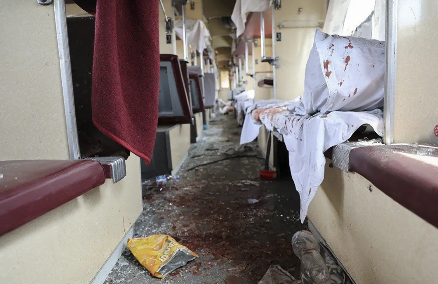 A handout photo made available by the Dnipropetrovsk Regional Military Administration shows a damaged passenger train following Russian shelling in the city of Dnipro, Ukraine, 24 June 2025. (EPA/Dnipropetrovsk Regional Military Administration handout) 