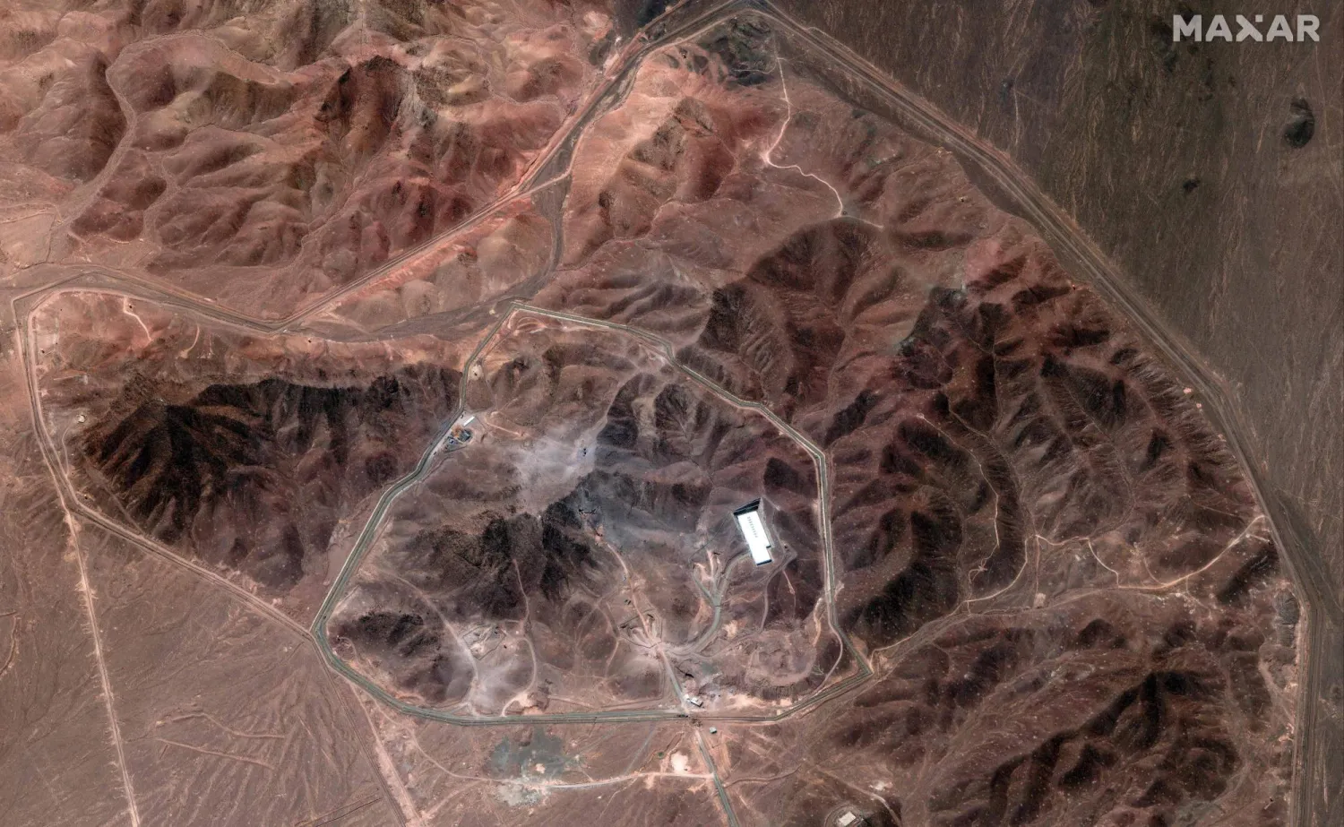 This handout satellite image provided by Maxar Technologies and dated June 29, 2025 shows an overview of the Fordow Fuel Enrichment Plant (FFEP) complex, about 30 kilometres north of Qom in central Iran. (Photo by Satellite image 2025 Maxar Technologies / AFP) 