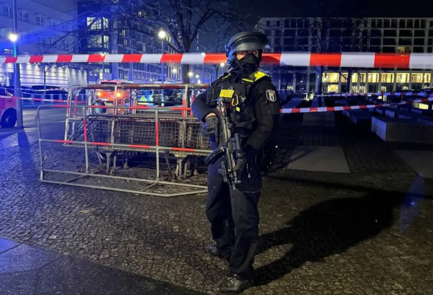 A German police officer guards the Holocaust Memorial after a man was seriously injured in a stabbing near the US Embassy in Berlin, Germany, February 21, 2025. (Reuters)
