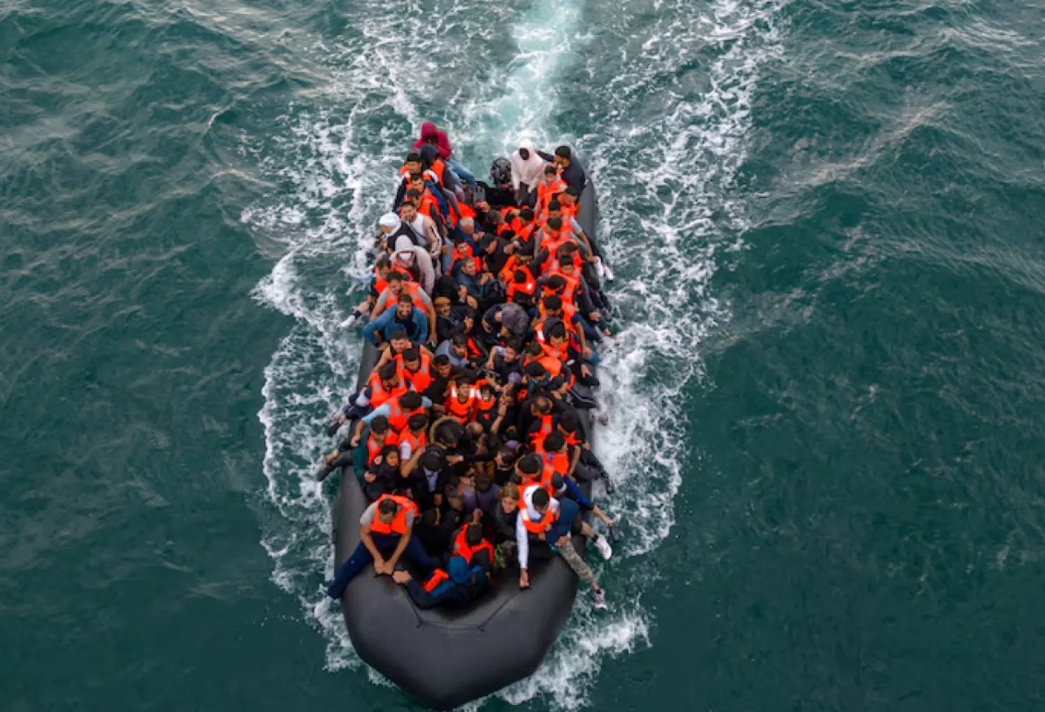 In this drone view an inflatable dinghy carrying migrants makes its way towards England in the English Channel, Britain, August 6, 2024. REUTERS/Chris J. Ratcliffe/File Photo 
