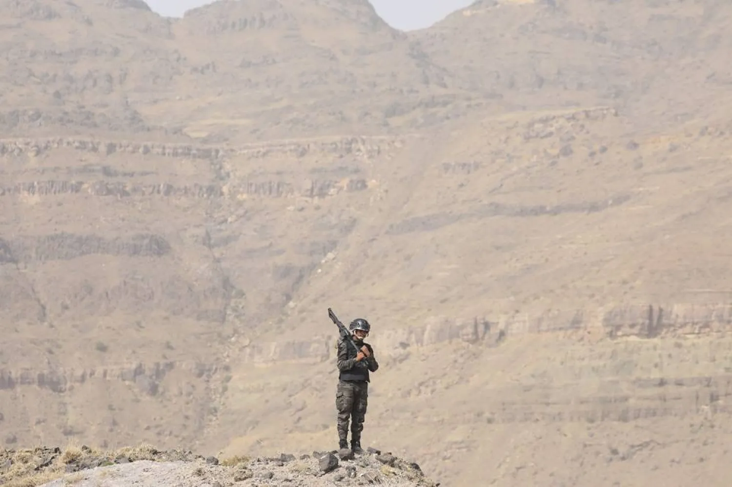 A Houthi militant patrols on a mountain overlooking the outskirts of Sanaa, Yemen, 01 July 2025. (EPA)