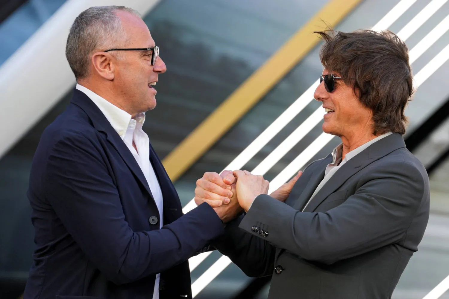 ستيفانو دومينيكالي برفقة توم كروز (رويترز)