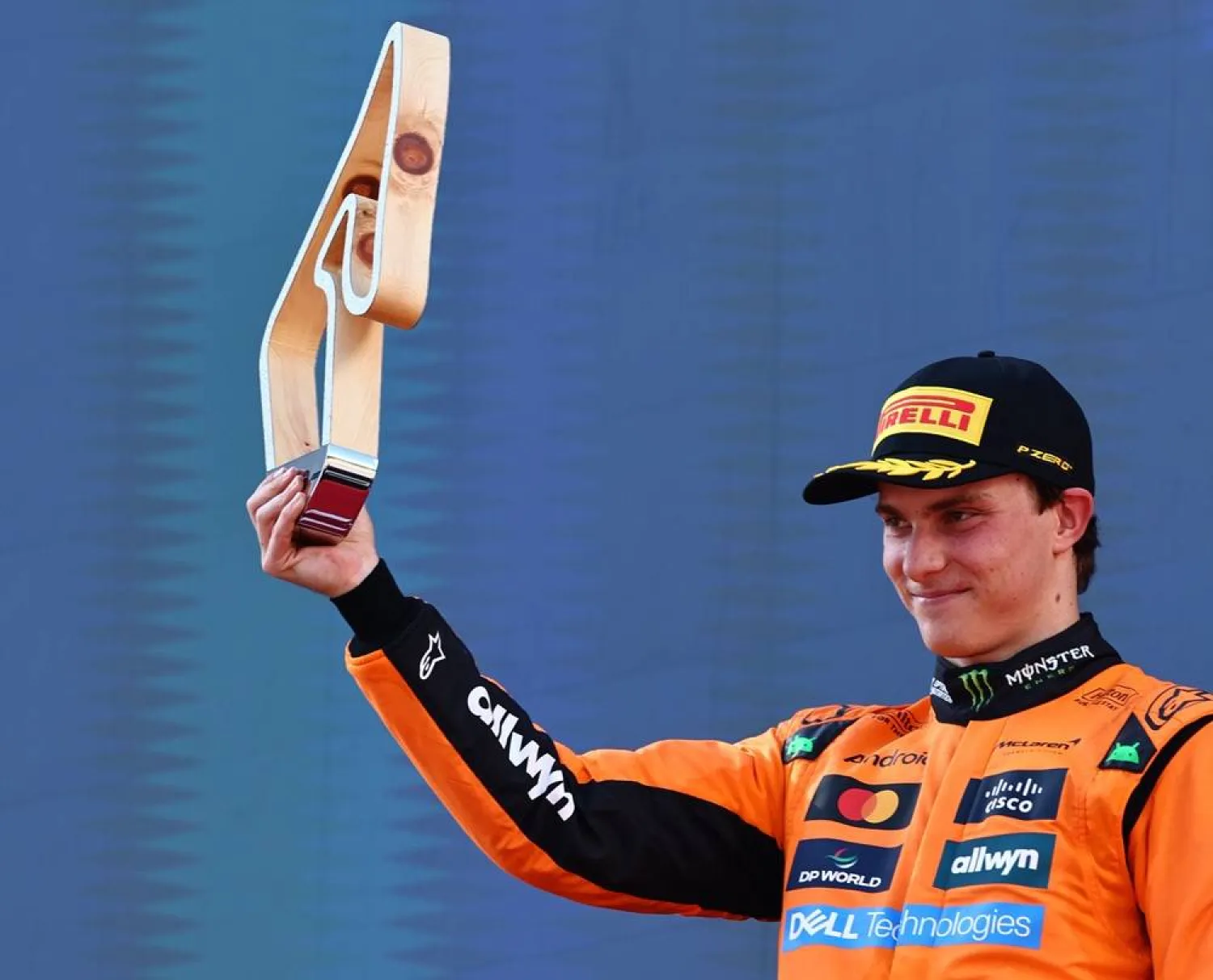 Second-placed McLaren driver Oscar Piastri of Australia poses on the podium with his trophy after the Formula 1 Austrian Grand Prix at the Red Bull Ring racetrack in Spielberg, Austria, 29 June 2025. (EPA)  