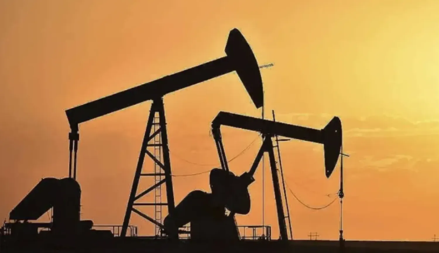 FILE - Pump jacks extract oil from beneath the ground in North Dakota, May 19, 2021. (AP Photo/Matthew Brown, File)