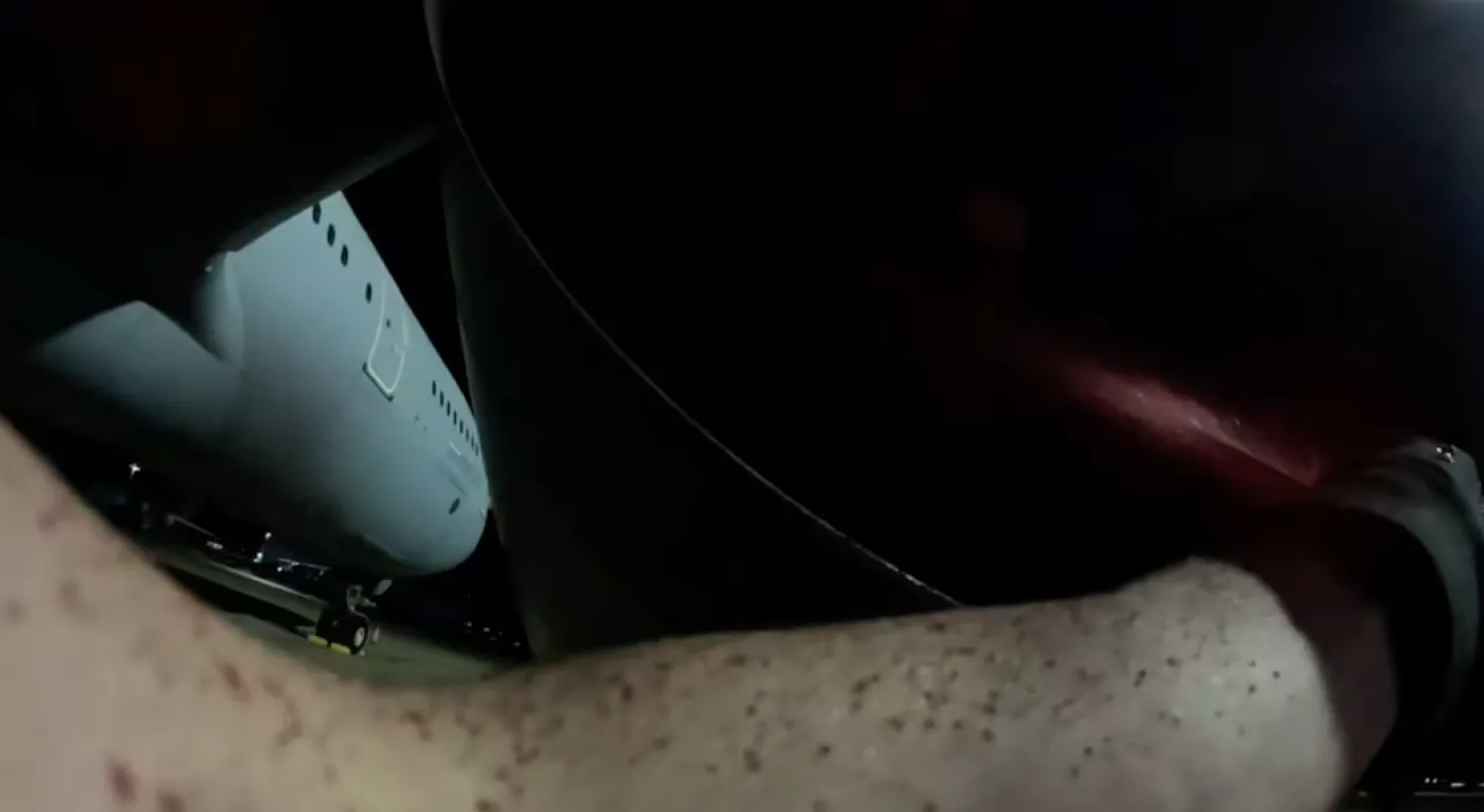 An activist from Palestine Action sprays a military aircraft engine with red paint at RAF Brize Norton, to damage it, in Carterton, Britain, June 20, 2025, in this still image obtained from handout video. The group's action was in protest of British military assistance to Israel, claiming that they, "interrupted Britain's direct participation in the commission of genocide and war crimes across the Middle East", stating on their website. Palestine Action/Handout via REUTERS/File photo
