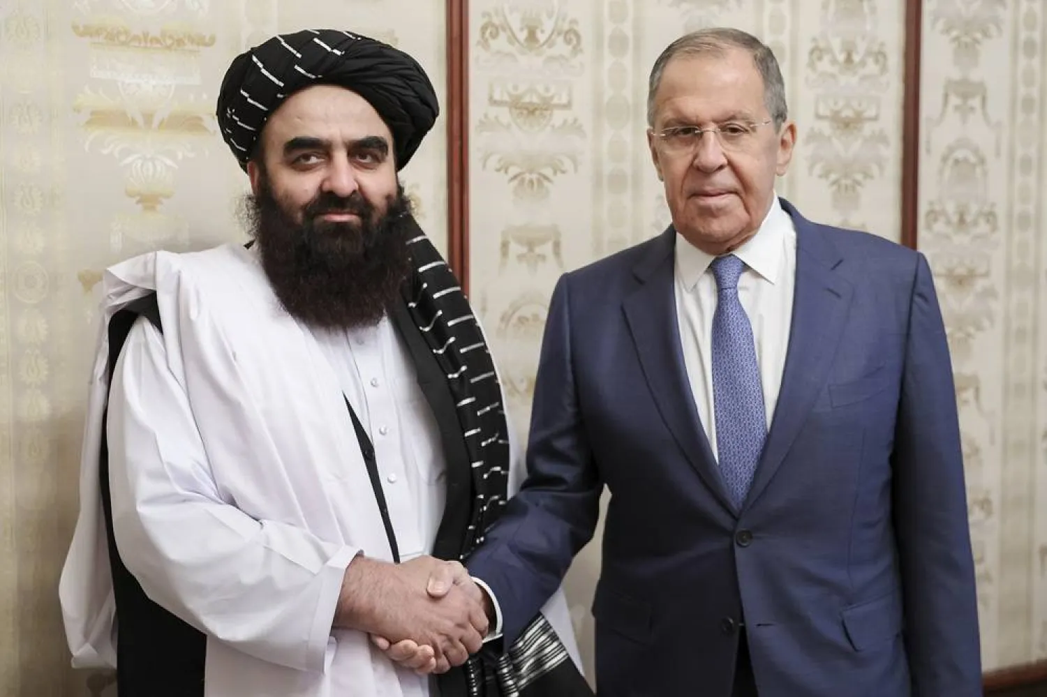 In this photo released by Russian Foreign Ministry Press Service on Oct. 4, 2024, Russian Foreign Minister Sergei Lavrov, right, and Acting Foreign Minister of Afghanistan's Taliban movement Amir Khan Muttaqi pose for a photo prior to their talks in Moscow, Russia. (Russian Foreign Ministry Press Service via AP, File) 