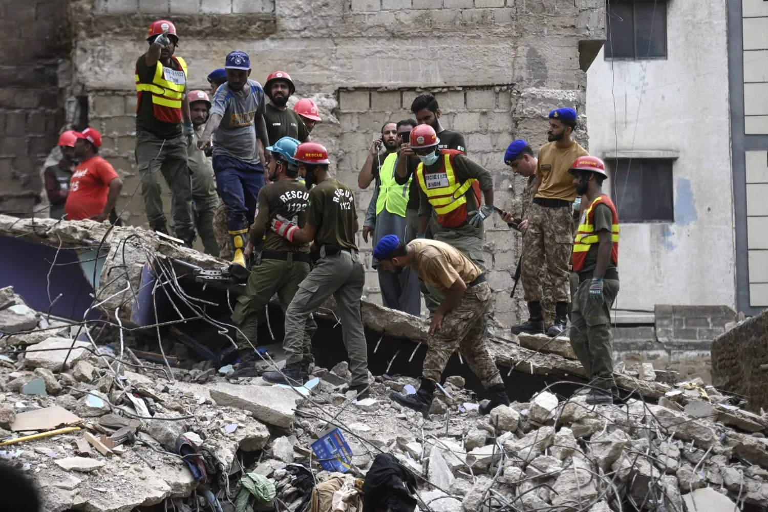 Rescuers search through the rubble for victims at the site of a collapsed building in Karachi, Pakistan, 04 July 2025. EPA/SHAHZAIB AKBER