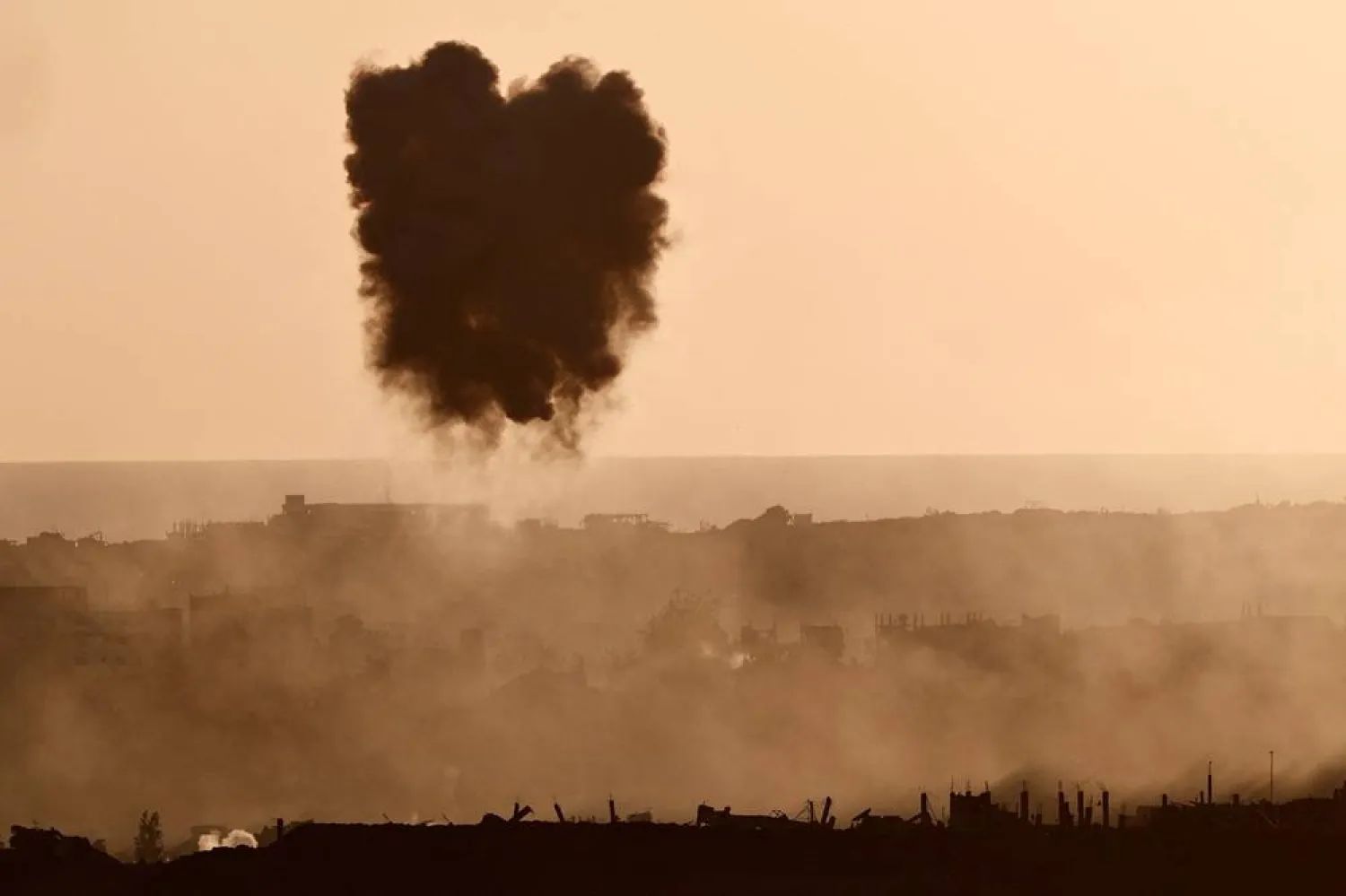  Smoke rises in Gaza following a military strike, as seen from the Israeli side of the border, July 5, 2025. (Reuters)
