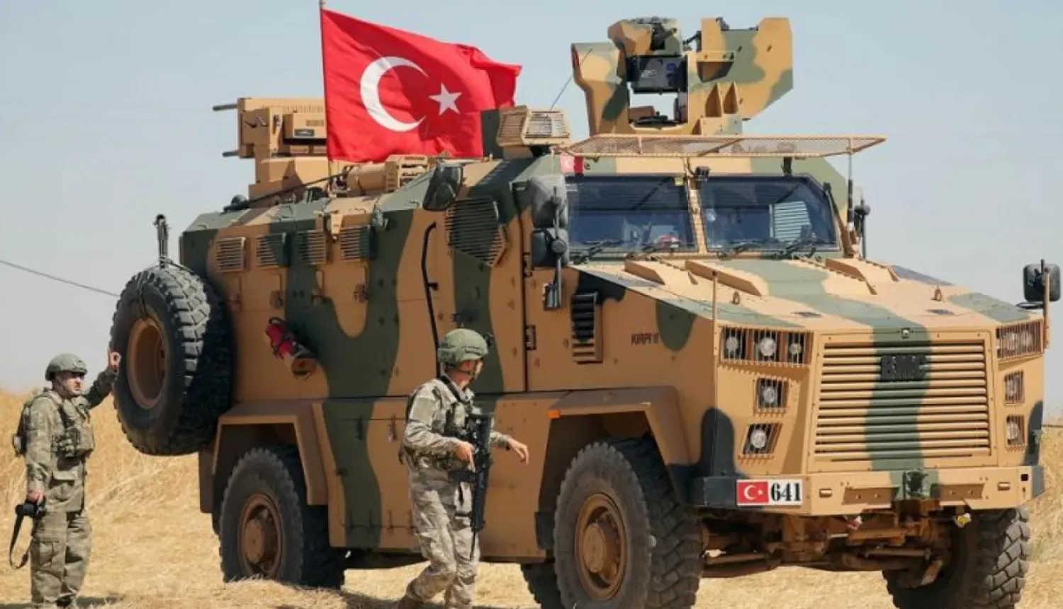 A Turkish soldier walks next to a Turkish military vehicle (File photo/Reuters)
