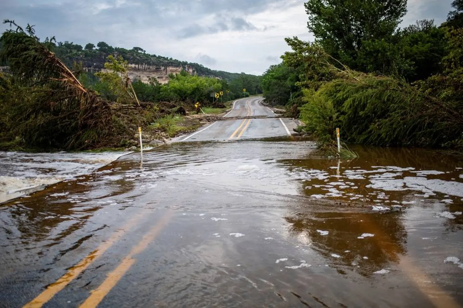  A portion of Highway 1340 is covered by the Guadalupe River in the aftermath of deadly flooding in Kerr County, Texas, US, July 7, 2025. (Reuters)