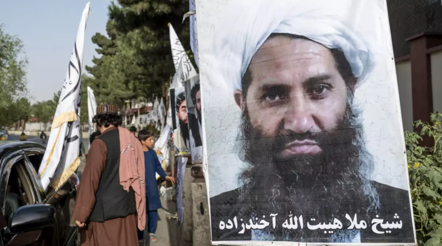 A poster of Taliban Supreme Leader Hibatullah Akhundzada is seen along a road in Kabul on August 14, 2023. © Wakil Kohsar, AFP
