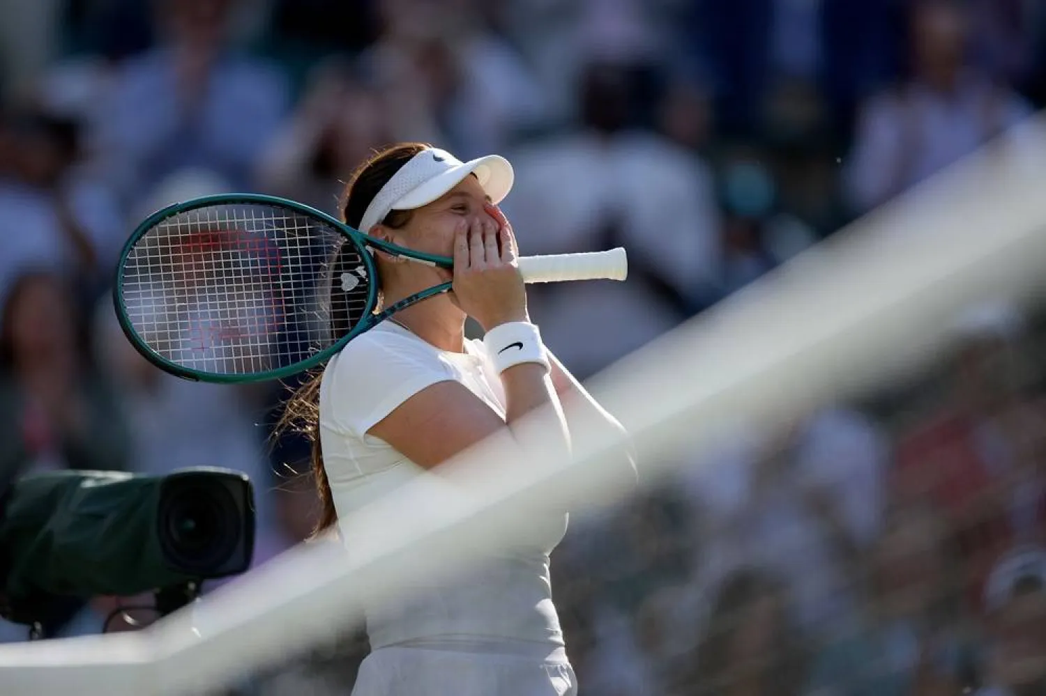 Amanda Anisimova of the USA greets spectators after winning her Women's quarterfinal match against Anastasia Pavlyuchenkova of Russia at the Wimbledon Championships, Wimbledon, Britain, 08 July 2025. (EPA)