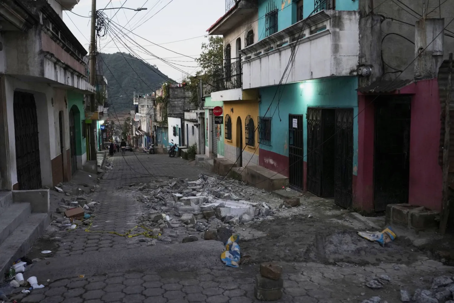 Debris lays on the street after dozens of earthquakes and aftershocks were recorded in a matter of hours in Palin, Guatemala, early Wednesday, July 9, 2025. (AP Photo/Moises Castillo)