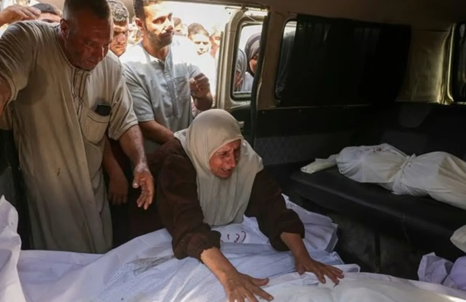 A Palestinian mourns a relative killed in a strike on a school-turned-shelter in northern Gaza - AFP
