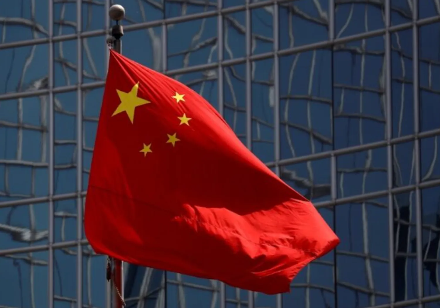 The Chinese national flag is seen in Beijing, China April 29, 2020. REUTERS/Thomas Peter/File Photo 