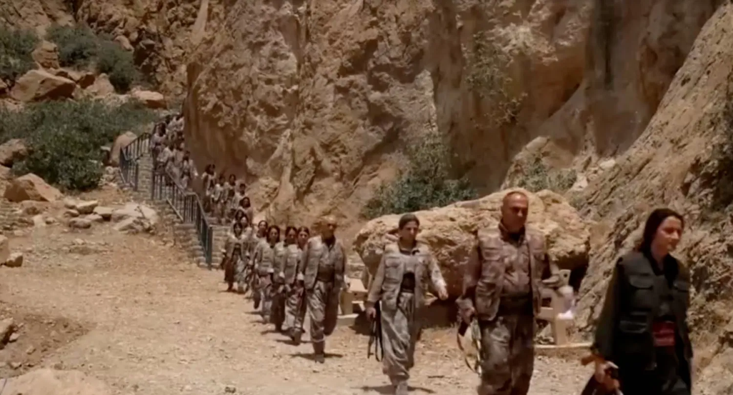  Armed PKK fighters arrive ahead of a disarming ceremony in Sulaimaniya, Iraq, July 11, 2025, in this screengrab obtained from a handout video. KURDISTAN WORKERS PARTY MEDIA OFFICE/Handout via REUTERS 