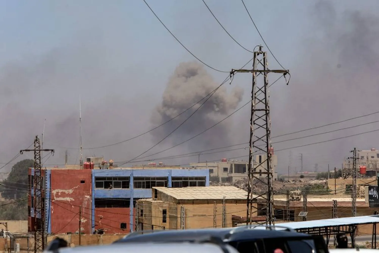 Smoke billows on the horizon during Israeli strikes near in the predominantly Druze city of Sweida on July 15, 2025, following clashes between Bedouin tribes and Druze fighters. (AFP)
