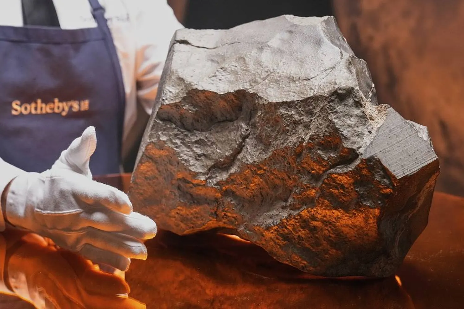 A Martian meteorite, weighing 54.388 lbs. (24.67 kg), said to be the largest piece of Mars on Earth, at Sotheby's, in New York, July 9, 2025. (AP)