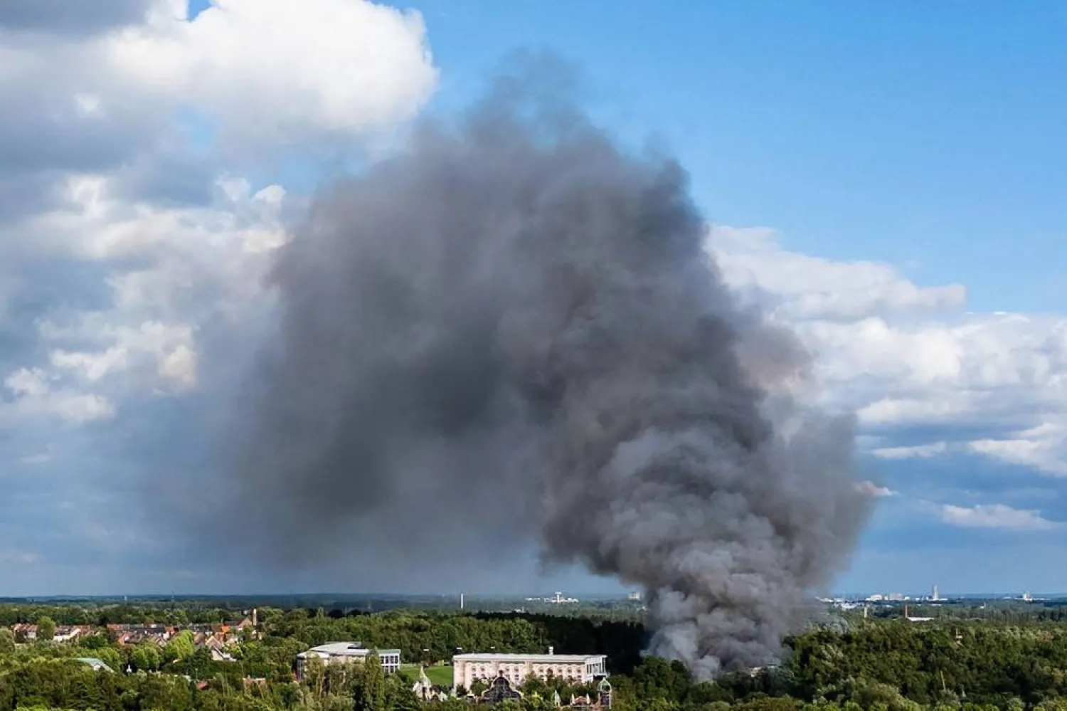  Smoke caused by a fire billows above the site of the Tomorrowland electronic music festival in Boom, northern Belgium on July 16, 2025. (AFP)