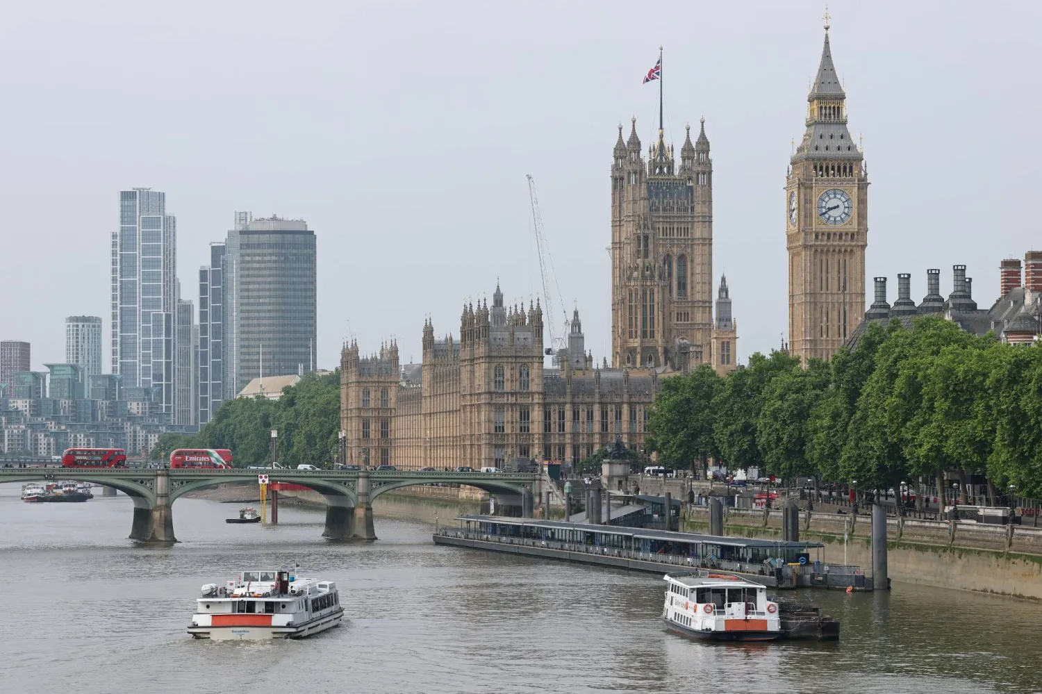 FILE PHOTO: Boats sail on the River Thames near to The Houses of Parliament, in London, Britain, June 9, 2025. REUTERS/Toby Melville/File Photo