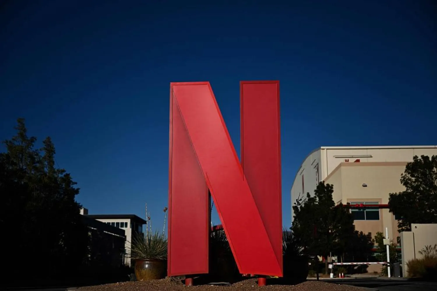 The Netflix logo is displayed at the entrance to Netflix Albuquerque Studios film and television production studio lot in Albuquerque, New Mexico, on October 13, 2023. (AFP)