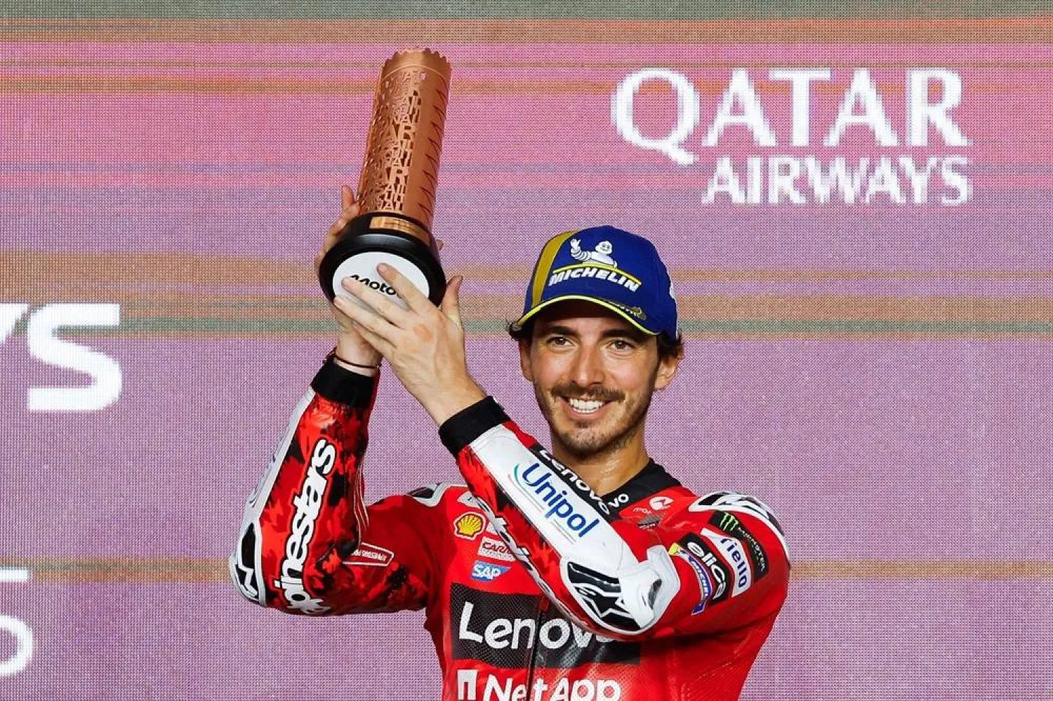 Third-placed Aprilia Racing's Spanish rider Jorge Martin celebrates on the podium at the end of the Qatar MotoGP Grand Prix at the Lusail International Circuit in Lusail, north of Doha on April 13, 2025. (AFP)