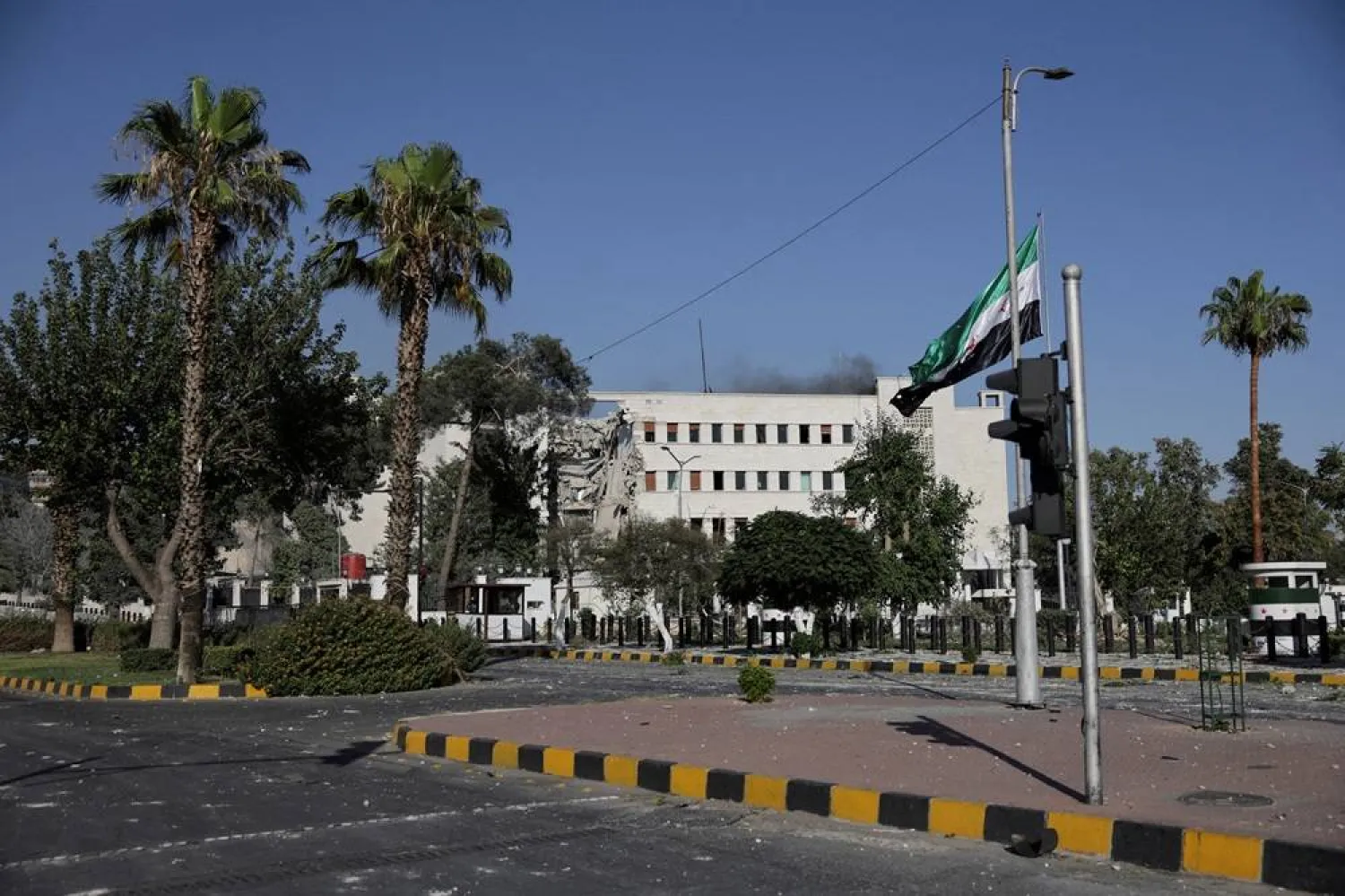 Smoke rises above the building, after powerful airstrikes shook Damascus on Wednesday, targeting the Defense Ministry, as Israel vowed to destroy Syrian government forces attacking Druze communities in southern Syria and demanded their withdrawal, in Damascus July 16, 2025. (Reuters)