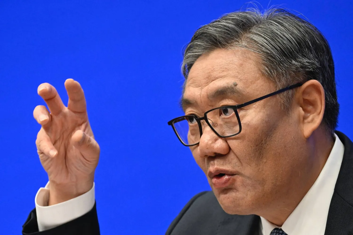 Wang Wentao, China's Minister of Commerce, speaks during a press conference in Beijing on July 18, 2025. (Photo by WANG Zhao / AFP)