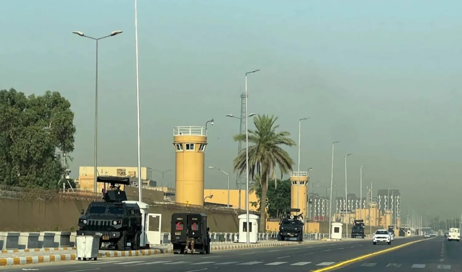 Vehicles belonging to the Iraqi security forces are seen outside the US embassy in Baghdad. Reuters file photo