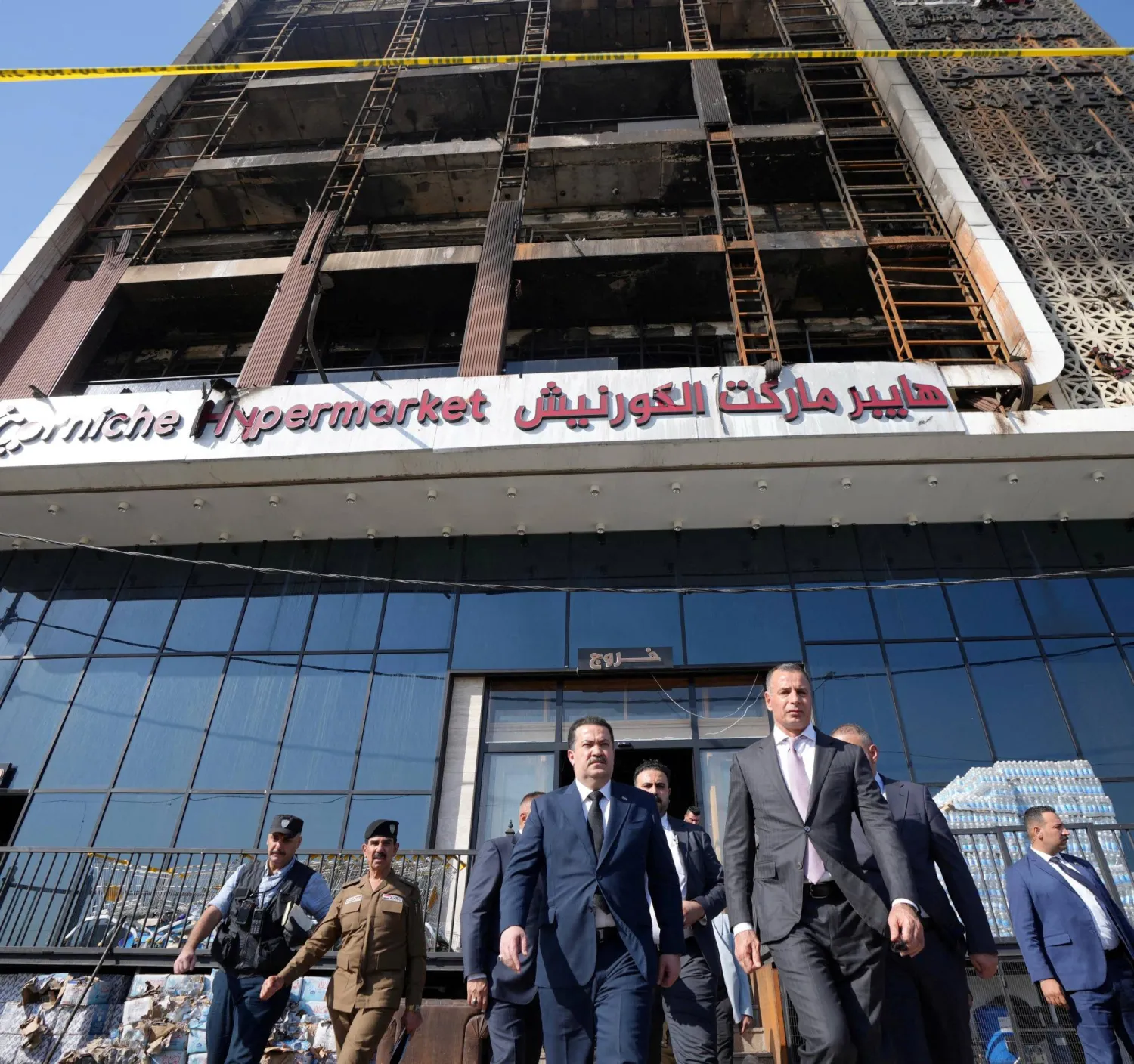 Iraqi Prime Minister Mohammed Shia al-Sudani visits a five-story shopping center after a massive overnight fire killed multiple people, in Al-Kut, Wasit province, Iraq, July 17, 2025. Iraqi Prime Minister Media Office/Handout via REUTERS