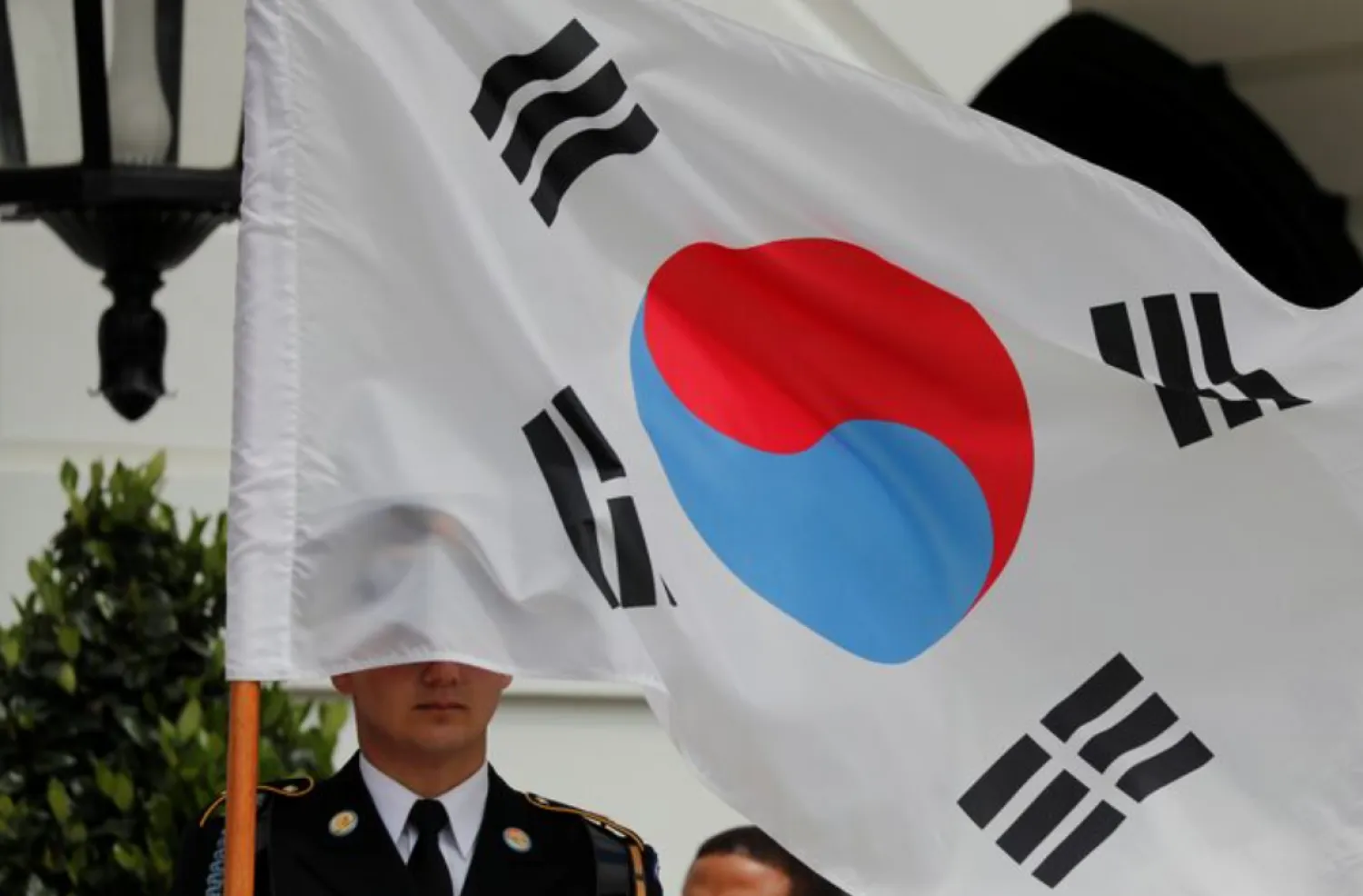 A South Korean flag covers a ceremonial guard member prior to the arrival of South Korea’s President Moon Jae-in at the White House in Washington, US, April 11, 2019. REUTERS/Carlos Barria/Files 