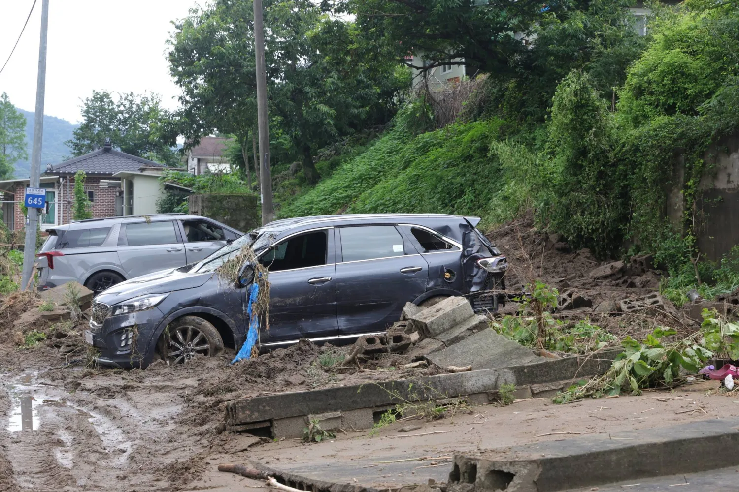Torrential Rain Leaves at Least 18 Dead in South Korea, Trail of Devastation