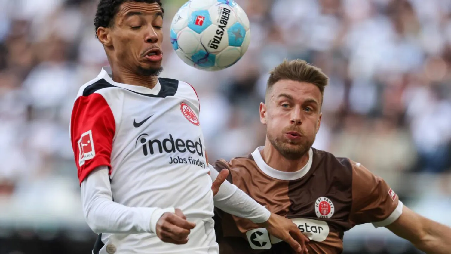 Eintracht Frankfurt striker Hugo Ekitike (L) is reportedly set to join Liverpool. Daniel ROLAND / AFP
