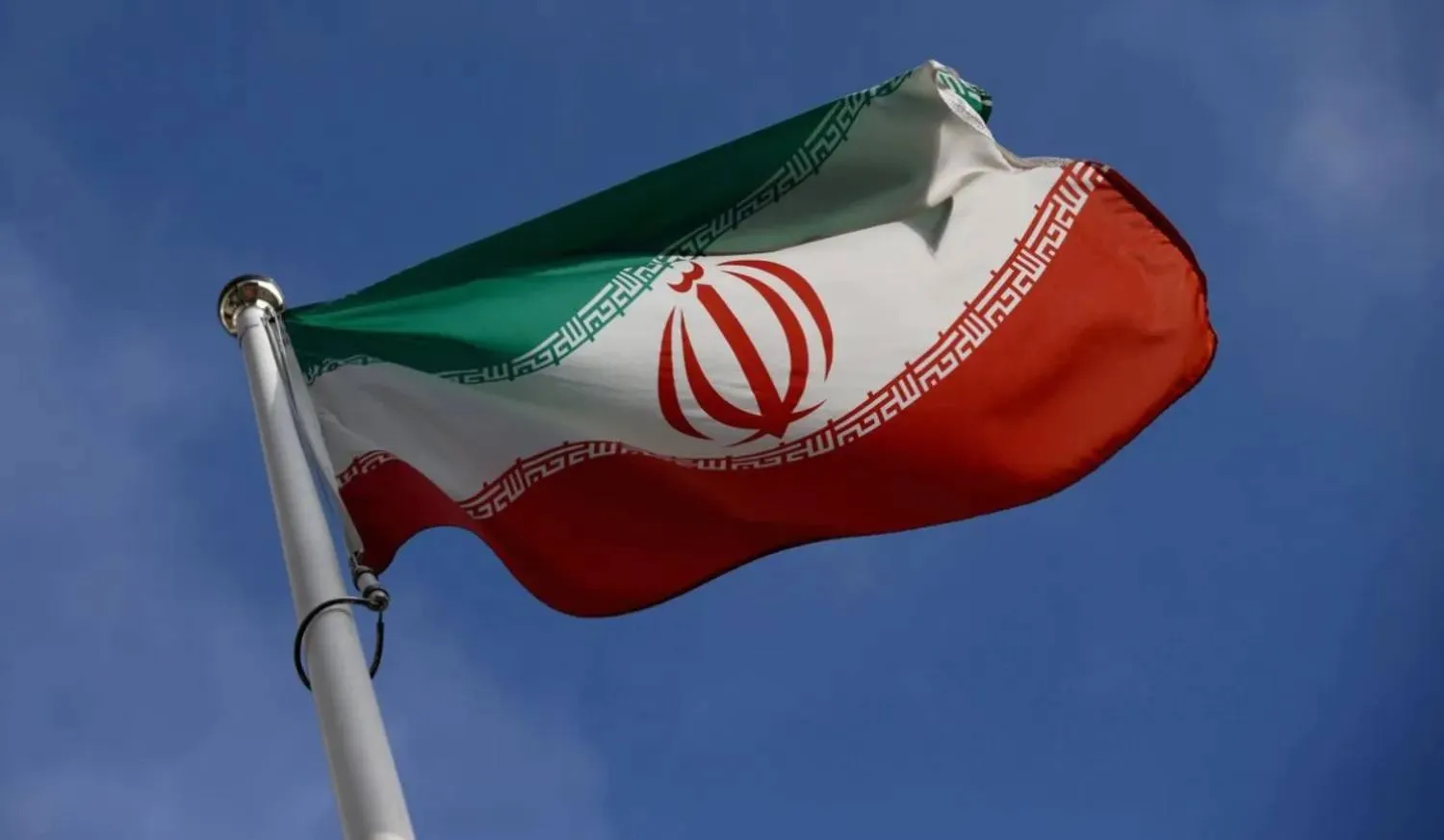 The Iranian flag waves in front of the International Atomic Energy Agency (IAEA) headquarters, before the beginning of a board of governors meeting, in Vienna, Austria, March 1, 2021. REUTERS/Lisi Niesner 