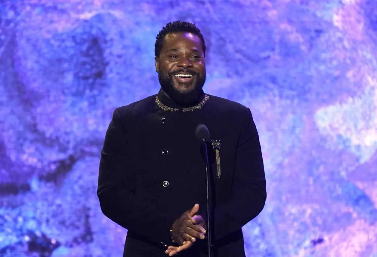 Malcolm-Jamal Warner speaks on stage at the 65th annual Grammy Awards on Sunday, Feb. 5, 2023, in Los Angeles. (AP)