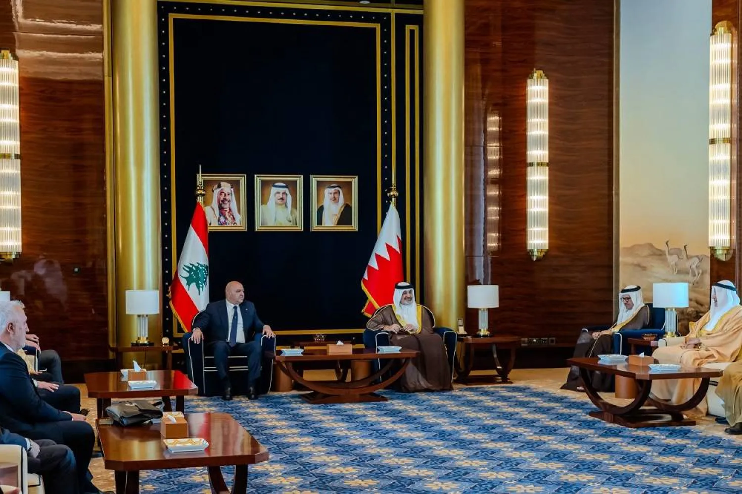 This handout picture from the official Bahrain News Agency (BNA) shows Sheikh Abdullah bin Hamad bin Isa Al-Khalifa (C-R) meeting with Lebanon's President Joseph Aoun (C-L) in Manama on July 22, 2025. (BNA) 
