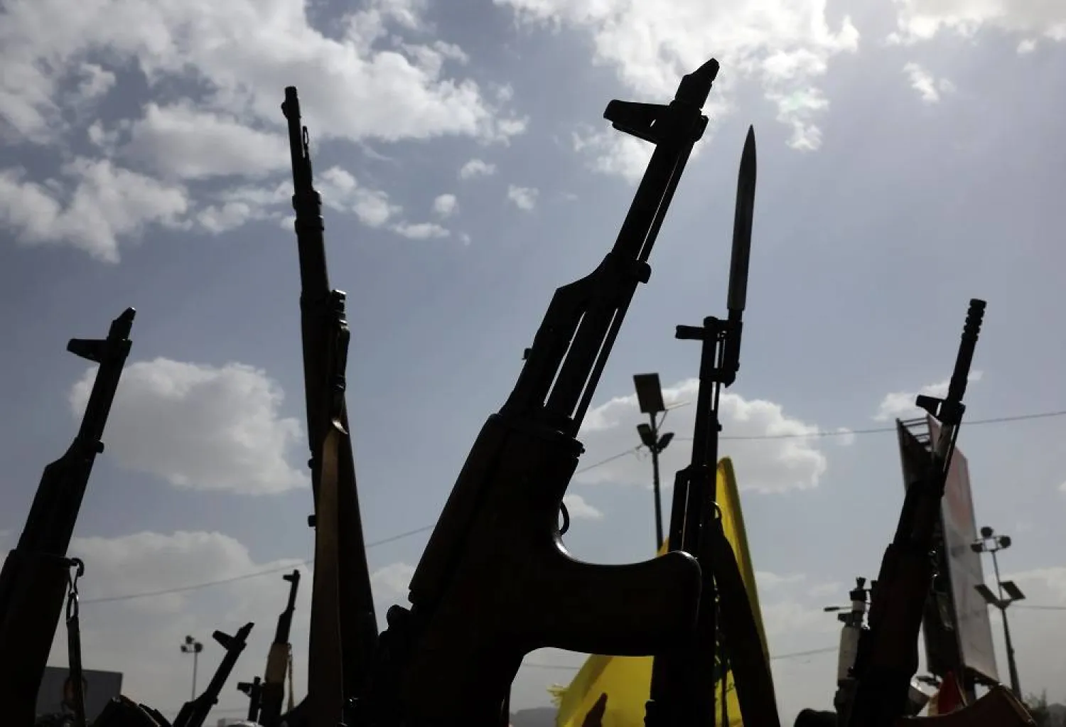 Houthi supporters hold up weapons during a protest against the US and Israel, in Sanaa, Yemen, 18 July 2025. (EPA)