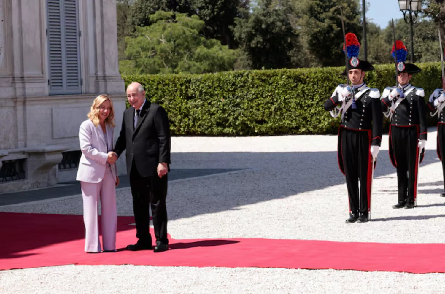 Italian Prime Minister Giorgia Meloni shakes hands with Algerian President Abdelmadjid Tebboune during the Italy-Algeria summit at Villa Doria Pamphilj in Rome, Italy, July 23, 2025. REUTERS/Remo Casilli