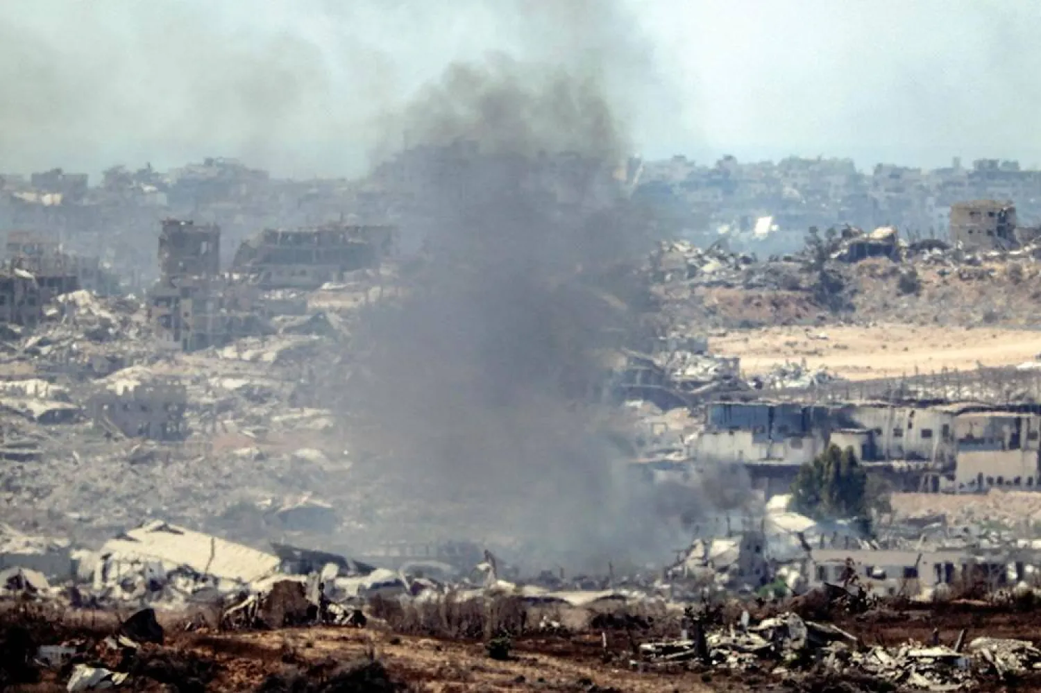 A plume of smoke erupts from Israeli bombardment in the Gaza Strip as pictured from a position along the border in southern Israel on July 23, 2025. (AFP)
