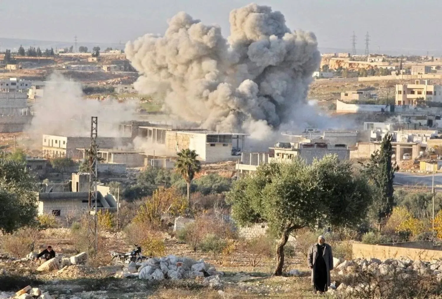 File photo: Smoke plume billows following Syrian regime air strike on residential district of Maaret al-Numan in northwestern Idlib province last week. (AFP)
