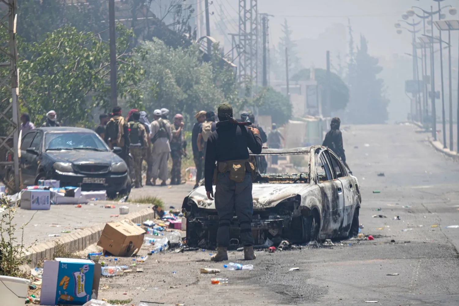 مشاهد الدمار في السويداء نتيجة الاشتباكات بين البدو والدروز (د.ب.أ)